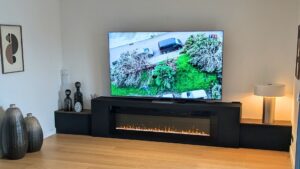 meuble TV XXL avec cheminée intégrée sur mesure menuiserie vienne